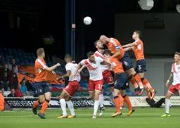 Glen Rea, Scott Cuthbert and Dan Potts climb on top of one another