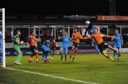Luke Berry flies in to attack a corner kick