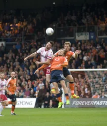 Johnny Mullins and Luke Berry combine to thwart Danny Newton