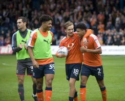 Luke Berry claims the match ball after scoring his hat-trick