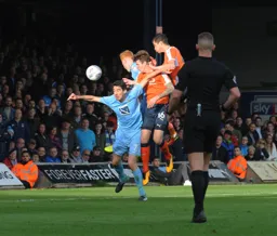 Glen Rea and Dan Potts attack the City goal