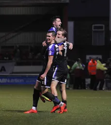 Dan Potts, Alan Sheehan and Luke Berry celebrate after Berry had scored Town`s second goal