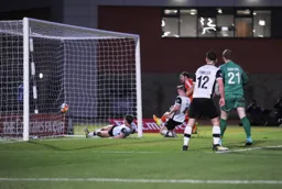 Danny Hylton nips in to add the fourth goal