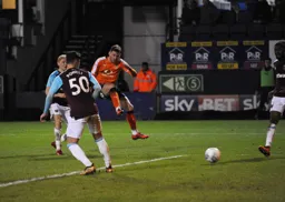 Jordan Cook takes a shot at goal
