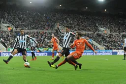 Andrew Shinnie shoots as Mikel Merino attempts a block