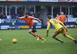 Andrew Shinnie moves forward at pace with the ball