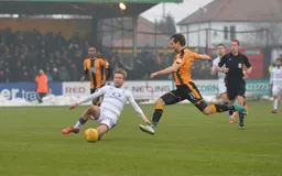 Luke Berry goes in for a sliding tackle