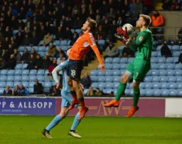 Luke Berry leaps for the ball but Lee Burge safely gathers it