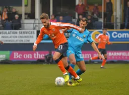 Andrew Shinnie turns away from Alex Nicholls