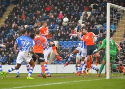 Dan Potts and Danny Hylton threaten the Colchester goal