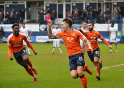 Glen Rea is off to celebrate after scoring the second goal. Pelly-Ruddock Mpanzu and Elliot Lee join in