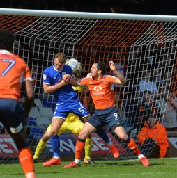 Danny Hylton puts pressure on the Crewe defence