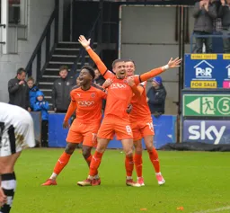 Olly Lee celebrates his goal with Pelly-Ruddock Mpanzu and Harry Cornick