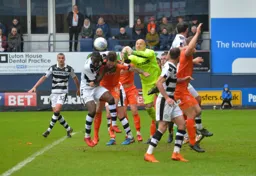 Glen Rea challenges for the ball but Cameron Belford fists the ball away