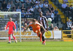 Glen Rea dives full length to head the ball clear
