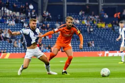 Andrew Shinnie grabs a handful of his marker