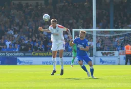 Sonny Bradley heads the ball away