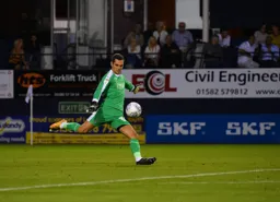 James Shea kicks the ball forward
