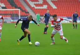 Harry Cornick in a race to the ball