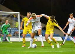 Harry Cornick shields the ball