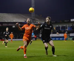 Danny Hylton has his eyes fixed on the ball