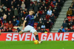 James Collins scores from the penalty spot