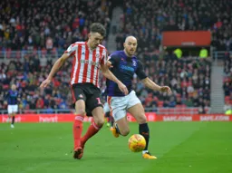 Danny Hylton tries to win the ball back