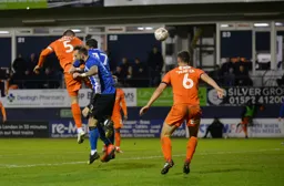 Sonny Bradley with a towering header