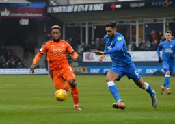 Kazenga Lualua tries to get to the ball first