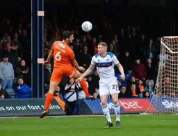 Matty Pearson jumps to win the header