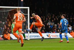 Danny Hylton slips the ball past the keeper to give Luton the lead