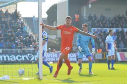 James Collins begins to celebrate scoring a goal