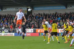 Matty Pearson rises for the header