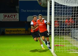 James Collins wheels away with George Moncur having equalised in the 85th minute.