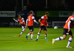 Andrew Shinnie bends one in from the edge of the box making it 3-0 Luton