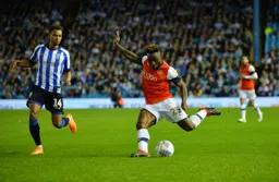 Kazenga LuaLua whipping in a cross as Jacob Murphy tracks him