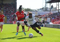 Kazenga LuaLua goes around the outside of Jordan Green