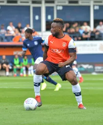 Kazenga LuaLua gets ready to drive forward with the ball