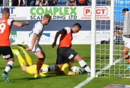 Matty Pearson thinks he can get the ball over the line, but George Long gathers