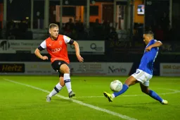 Luke Bolton challenging Youri Tielemans