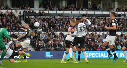 The ball is whipped in but Sonny Bradley can't get on the end of it