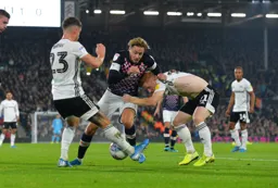 Harry Cornick trying to find a way through Joe Bryan and Harrison Reed