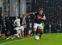 Luke Bolton having won the ball off Tom Cairney, scampers off down the wing