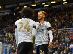 Harry Cornick celebrates with Izzy Brown after levelling the match