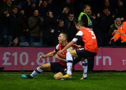 James Collins celebrates his equaliser with Dan Potts