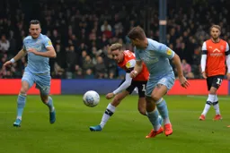 Harry Cornick pressing Gaetano Berardi with Jack Harrison and Andrew Shinnie watching on