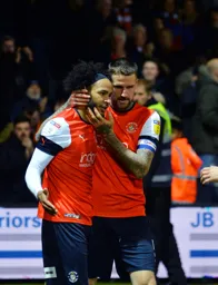 Captain Sonny Bradley congratulates Izzy Brown after his goal puts the Hatters 2-1 ahead