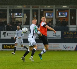 James Collins flicks the ball on