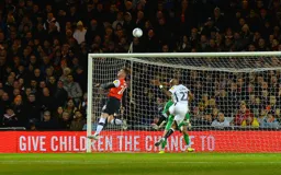 James Bree makes an excellent defensive header to prevent Andre Ayew getting a certain attempt at goal