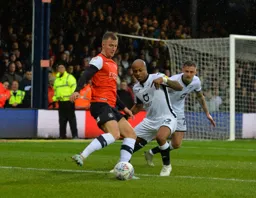 James Bree trying to find space to work it into the box, but Andre Ayew is keeping a close eye on him